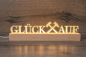 Preview: LED-Acrylglaslampe mit Holzsockel: Schriftzug „GLÜCK AUF“ mit Schlägel & Eisen, warmweißes Licht (USB).